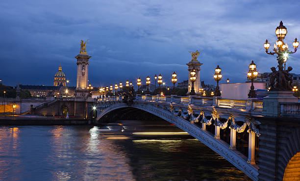 istock Alexander the Third bridge and Seine at night in Paris 465587705