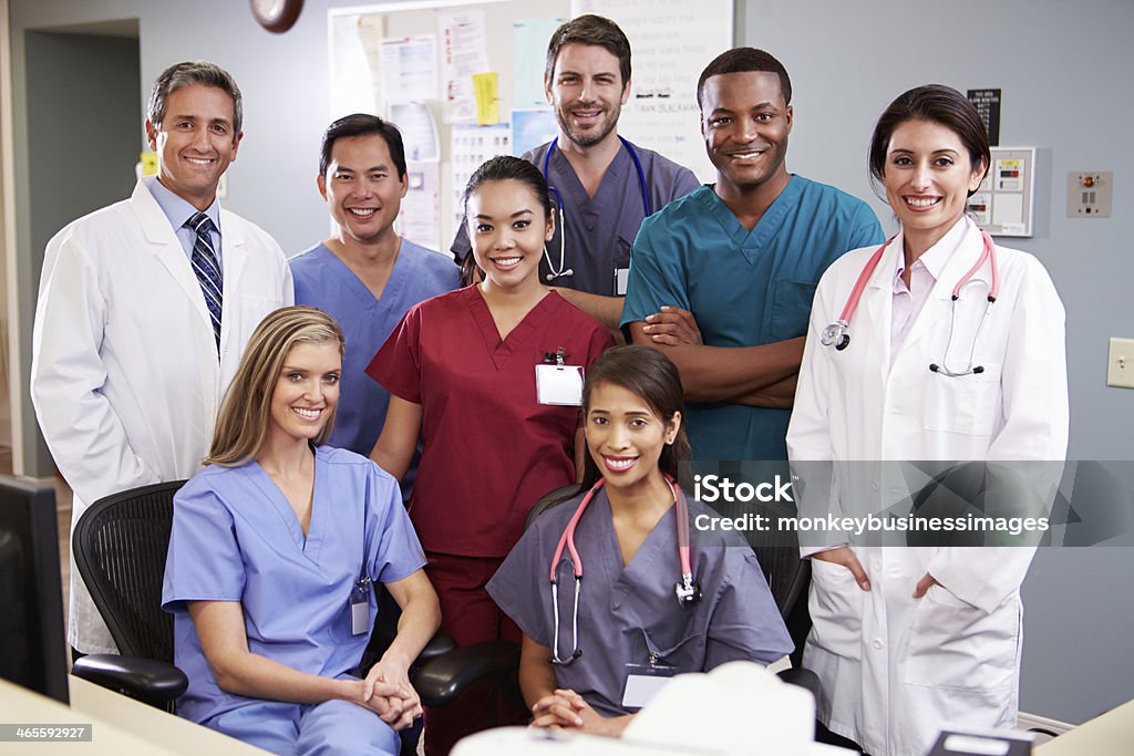 Portrait Of Medical Team At Nurses Station Portrait Of Medical Team At Nurses Station Smiling At Camera Group Of Animals Stock Photo