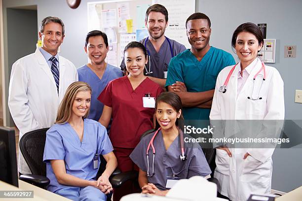 Portrait Of Medical Team At Nurses Station Stock Photo - Download Image Now - Group Of Animals, Teamwork, Doctor