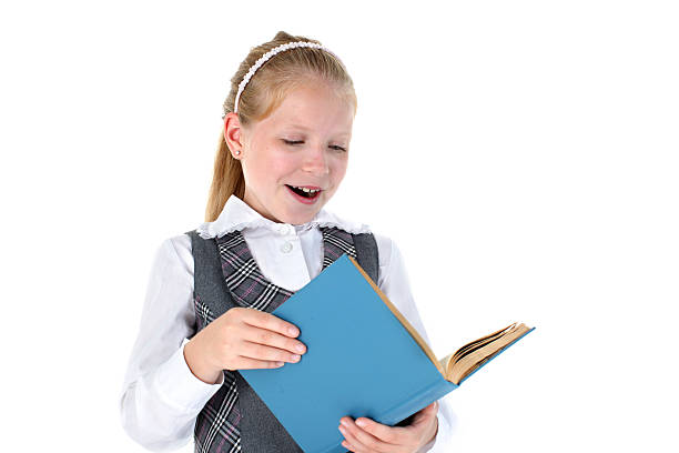istock school girl with book smiling on white background 465597556