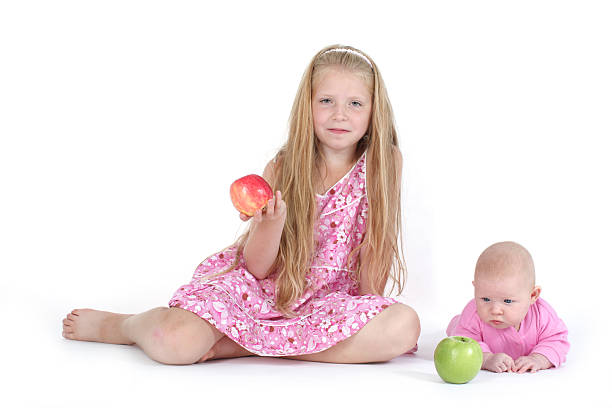istock adorable little two sisters 465597558