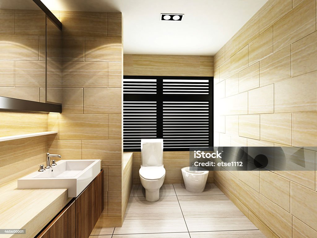 Modern, bathroom with sand colored tiles Modern Toilet in Bathroom of residences or hotels Guest Stock Photo