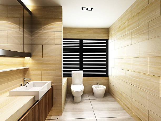 Modern, bathroom with sand colored tiles Modern Toilet in Bathroom of residences or hotels guest bathroom stock pictures, royalty-free photos & images