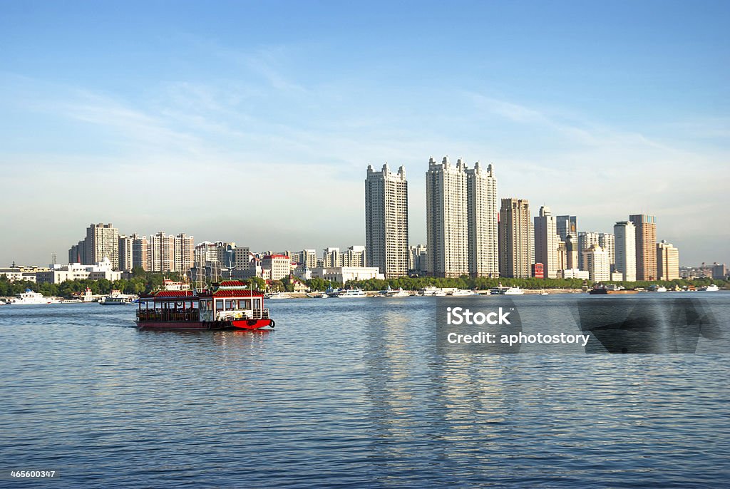 Cruise ship in Songhua River Pavilion styles cruise ship head for Sun Island Park in Songhua River (Songhuajiang) at dusk, Harbin City, Heilongjiang Province, China. China - East Asia Stock Photo