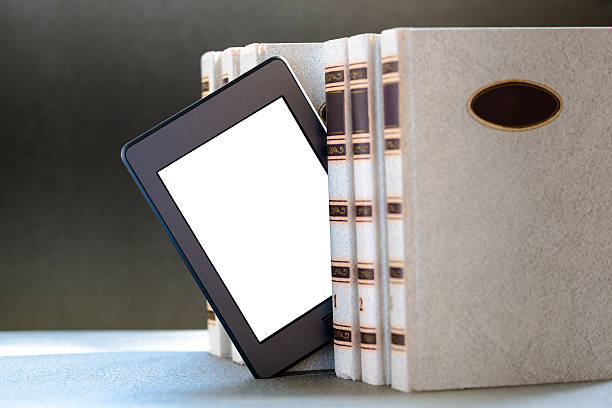 Ebook and old books on table stock photo