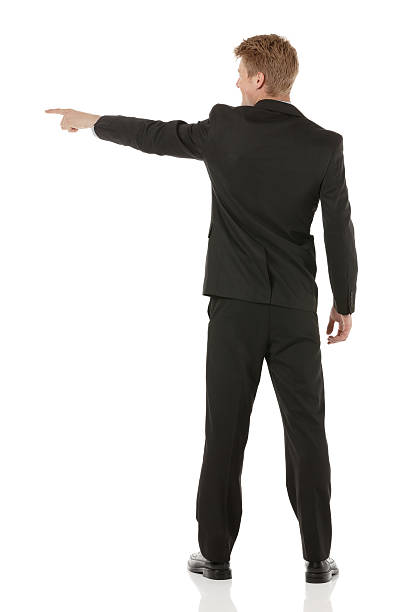istock Rear view of businessman pointing 465608347