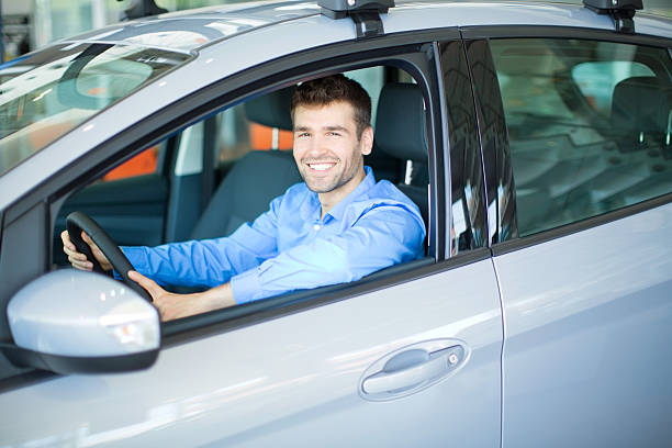 Men bying car. Handsome men sitting in a car at car dealership.  car portrait men expertise stock pictures, royalty-free photos & images