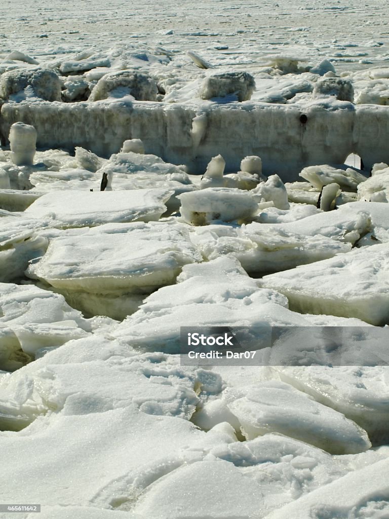 Ice Crushed ice sheets by frozen lake . 2015 Stock Photo