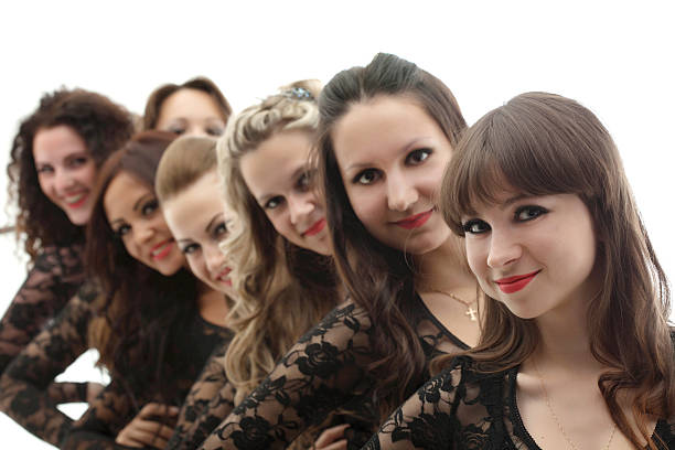 istock Group of young smiling girls posing in studio 465611645