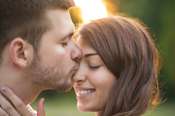 istock Kissing couple close up 465612918