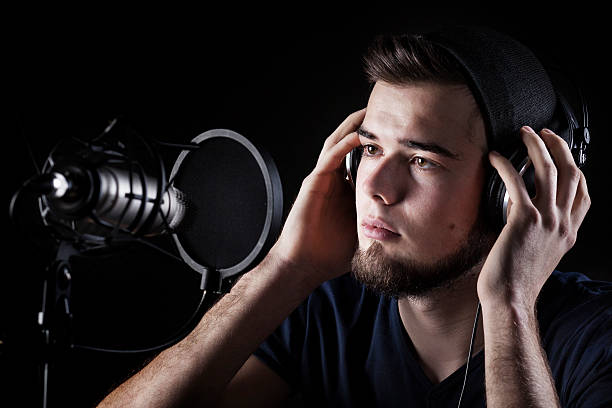 istock Young male singer sound recording studio 465615492