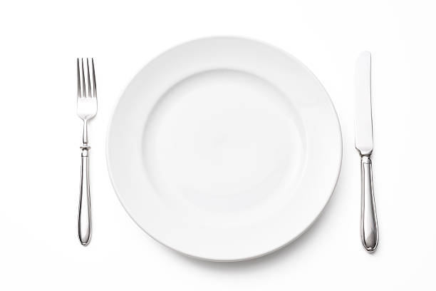 istock Isolated shot of white plate with silverware on white background 465615554