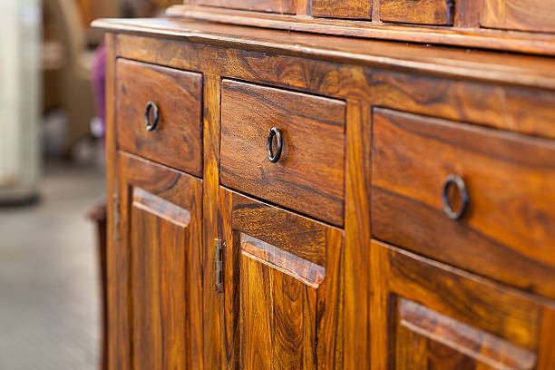 Wooden cabinet with drawers and handles stock photo