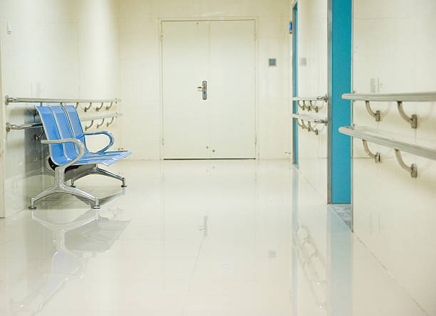 istock Blue chairs in a hospital hallway 465615793