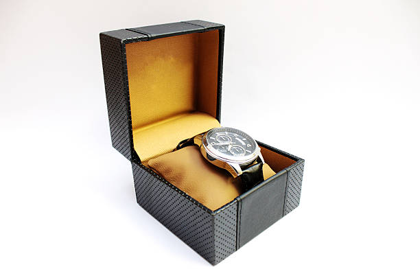 istock Watch on yellow pillow in back gift box on white background 465616725