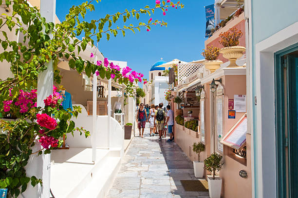 Shopping street in Oia town on Santorini, Greece. stock photo