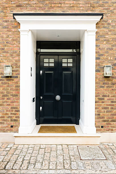 istock Black front door of a house, London UK 465619774