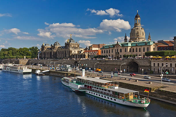 Cityscape of is a historic architectural ensemble in Dresden with Brühl's Terrace, Frauenkirche dome and Elbe river with the steamboat embankment, Germany
