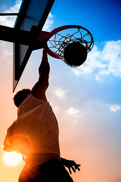 istock Low angle shot of a basketball player shooting a basket 465624151