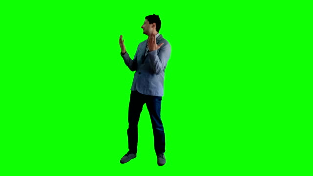 A man in a jacket on a background of the delights of a green screen