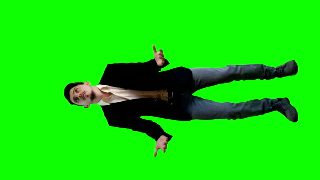 A man in a jacket on a background of the delights of a green screen