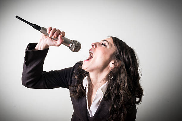 istock singing beautiful young businesswoman 465625325