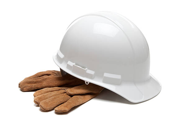 istock Hard hat and leather work gloves on white 465625502