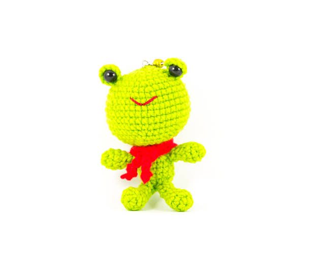 istock handmade crochet green frog doll on white background 465626263