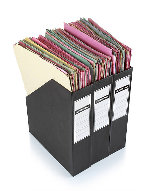 Documents in binders Stack of documents in binders against white background. Office life. tabs ring binder office isolated stock pictures, royalty-free photos & images