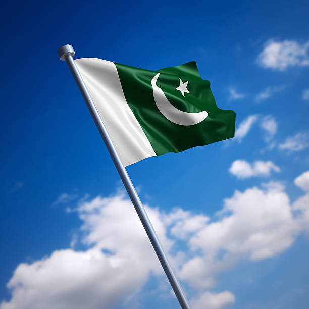 Flag of Pakistan against blue sky stock photo