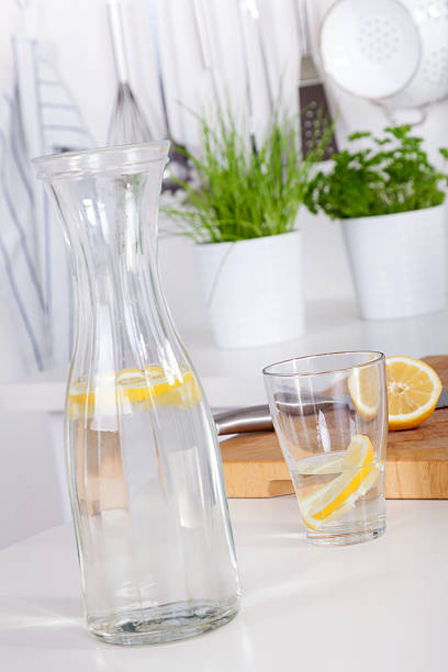 istock glass and carafe with lemonade on a kitchen counter 465631047