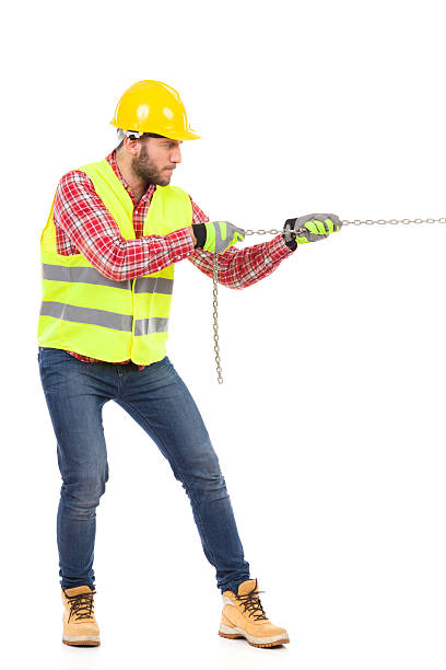 Pulling Works 720+ Construction Worker Pulling Stock Photos, Pictures & Royalty-Free ...