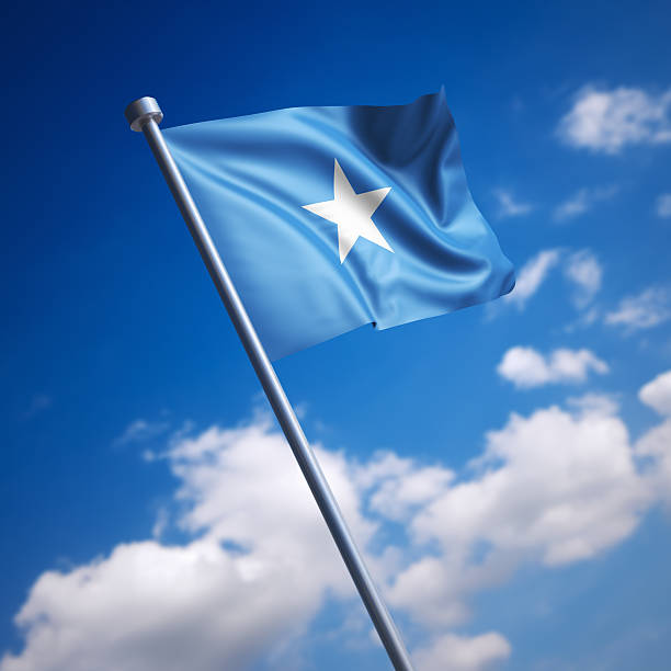 Flag of Somalia against blue sky stock photo