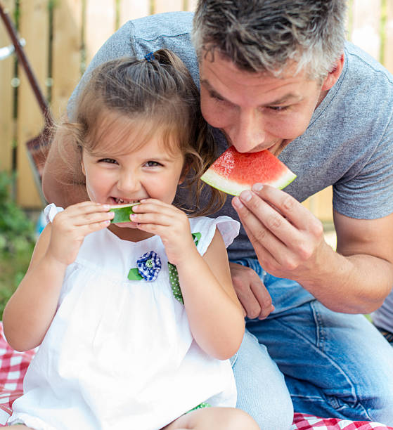istock Family having watermelon on a picnic 465635433