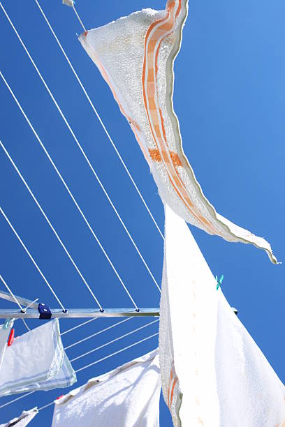 istock Laundry on a rotary clothes dryer 465637329