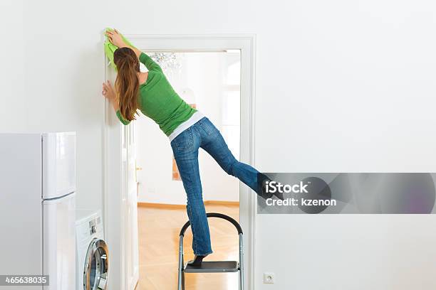 Woman At The Spring Cleaning Working Dangerously Stock Photo - Download Image Now - Misfortune, Domestic Life, Home Interior