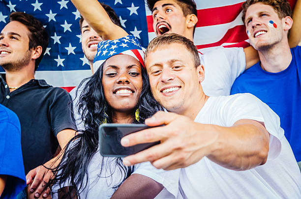 istock Young American supporters Selfie at stadium 465639806