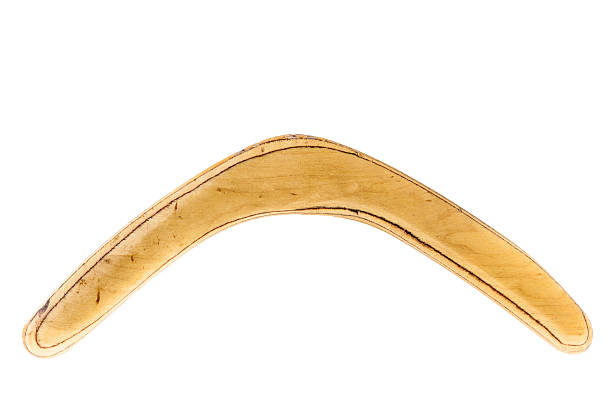 Boomerang a simple wooden boomerang isolated over a white background downunder stock pictures, royalty-free photos & images