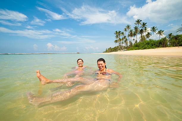 istock Two women having fun in the ocean 465643867