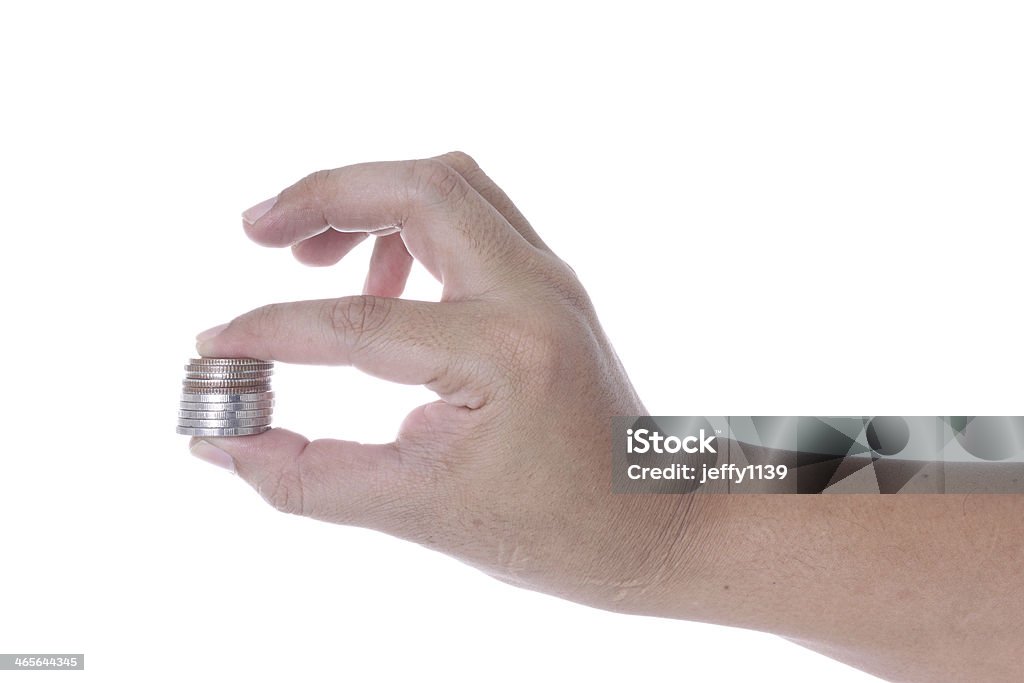 Рука с монетами - Стоковые фото Белый фон роялти-фри