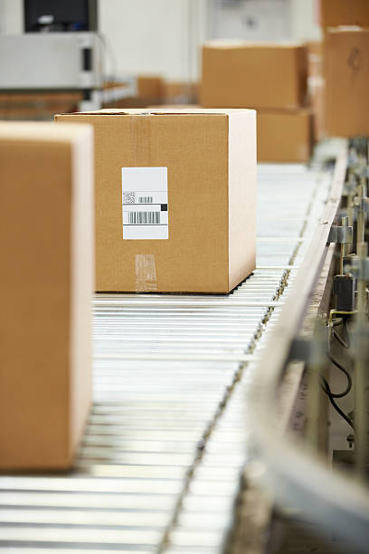 istock Goods On Conveyor Belt In Distribution Warehouse 465644931