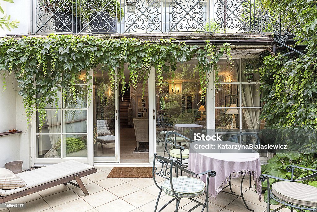 Vintage mansion - veranda Vintage mansion - a cosy veranda with an ivy Ivy Stock Photo