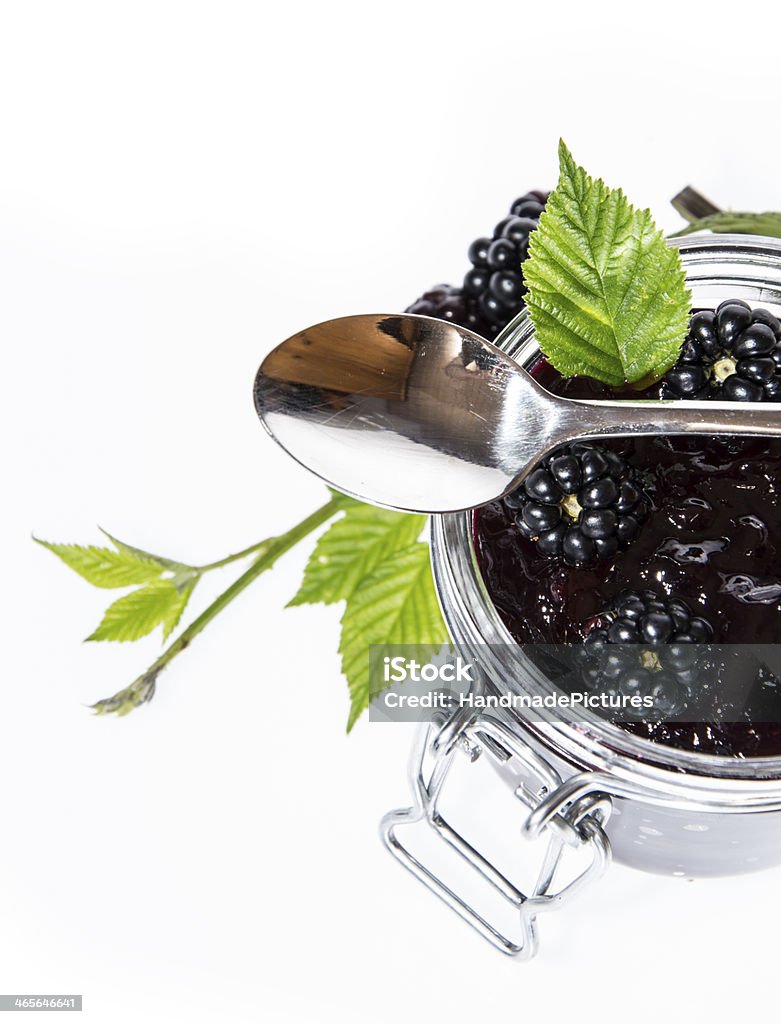 Glass with homemade Blackberry Jam on white Glass with homemade Blackberry Jam isolated on white background Berry Stock Photo