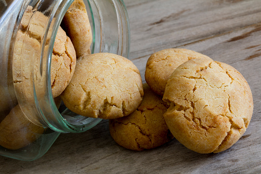 Hokey Pokey Biscuits in a Jar Spilling Over on to a Table