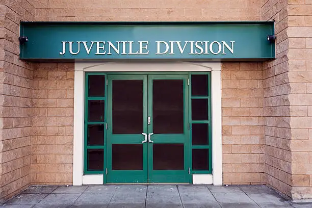 Juvenile Division entrance to police station.  Also known as "juvie". Horizontal.