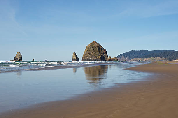 istock Oregon Cannon Beach North Coast Rocks Surf Land Blue Sky 465648892