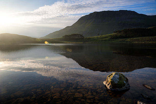 istock Beautiful sunrise mountain landscape reflected in calm lake 465651147