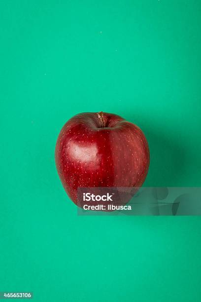 Red Apple On Green Paper Background Minimalist Still Life Stock Photo - Download Image Now