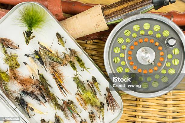 Fly Fishing Rod Reel Flies And Antique Creel Closeup Stock Photo - Download Image Now