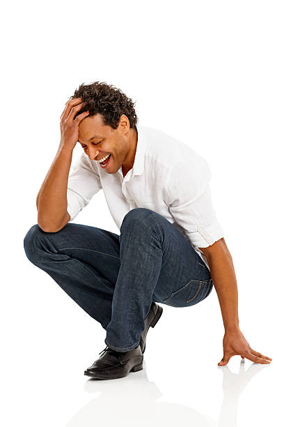 istock Smiling mature man crouching on floor 465653253